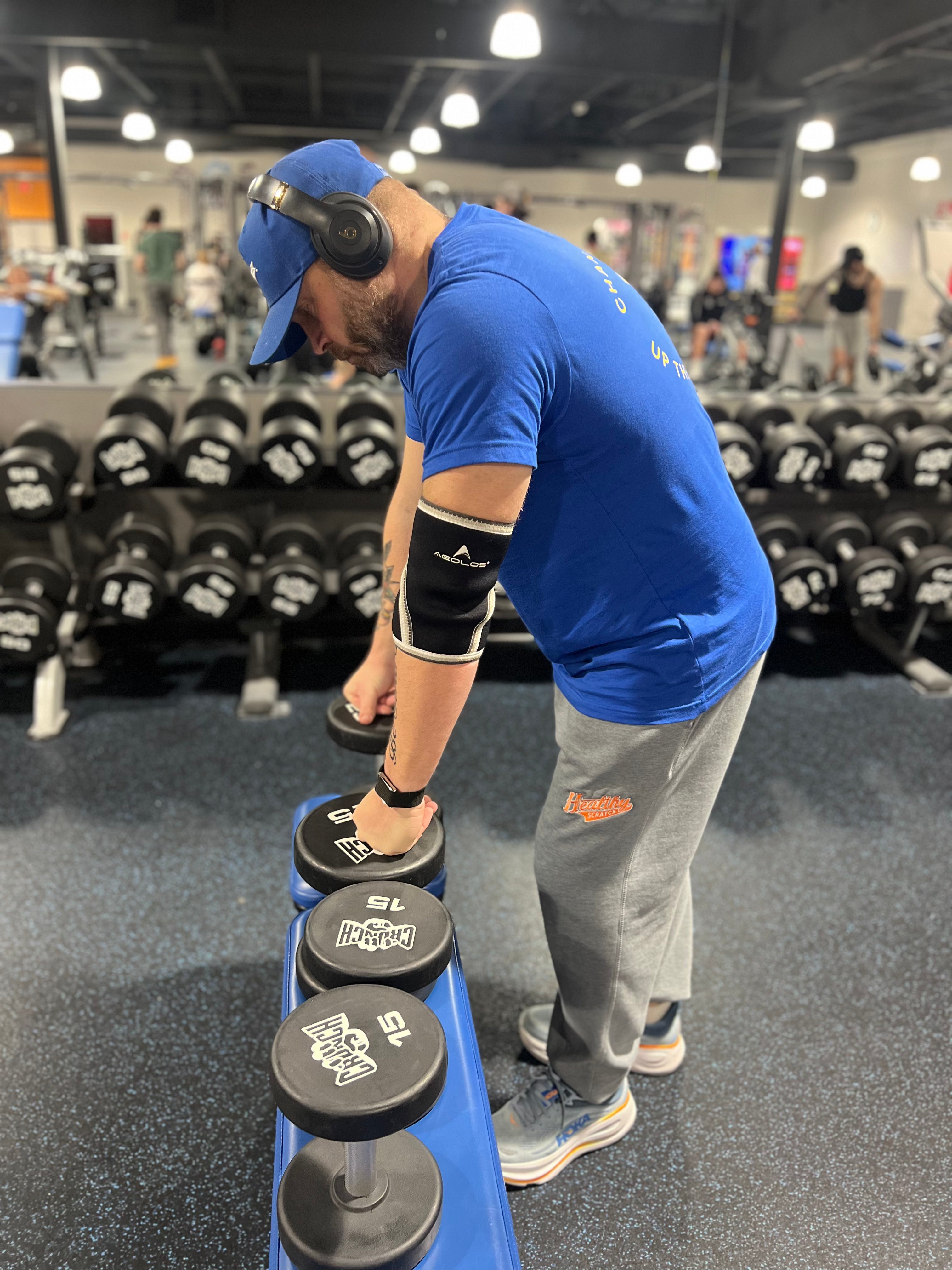 Person lifting weights in a gym setting
